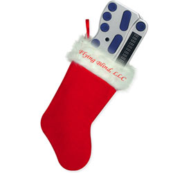 Photo of a bright red holiday stocking with Flying Blind, LLC embroidered across the top and a brand new BraillePen 12 sticking out of the top of the stocking.