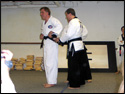 Photo of the LTrain adjusting the fit of his new Black Belt.